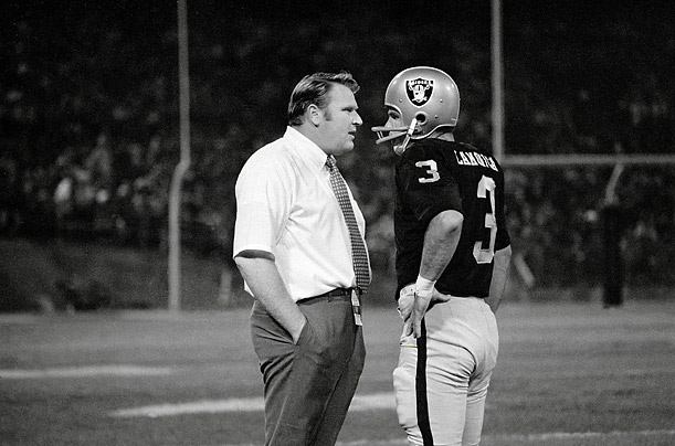 In 1969 Madden became the head coach of the Oakland Raiders. In this 1970 photograph, the coach confers with his quarterback, Daryle Lamonica.