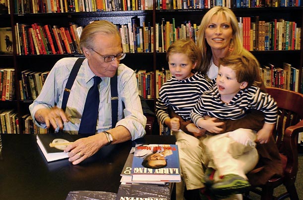 King and his wife Shawn (holding their two children) sign books at a bookstore in Los Angeles. The marriage is King's seventh.