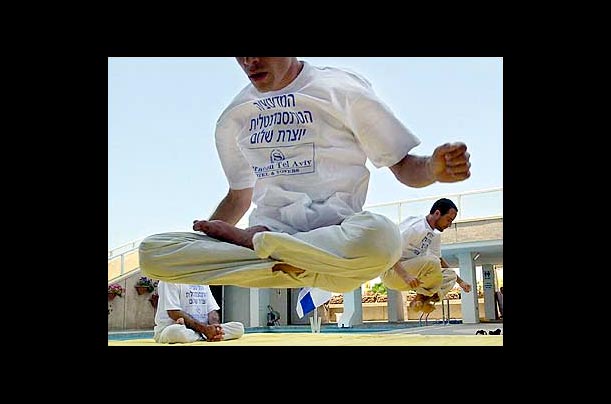Israeli experts in Transcendental Meditation and Yogic Flying demonstrate their technique in Tel Aviv