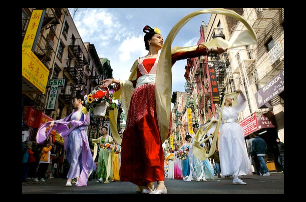 thousands of falun gong followers parade through chinatown in new york city
