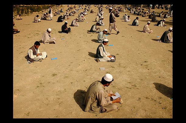 Afghan boys complete chemistry tests at Sayed Abad High School in Afghanistan