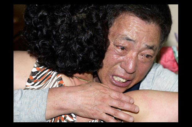 The parents of Kim Sun-il at their home in Busan, South Korea, after learning their son had been beheaded in Iraq