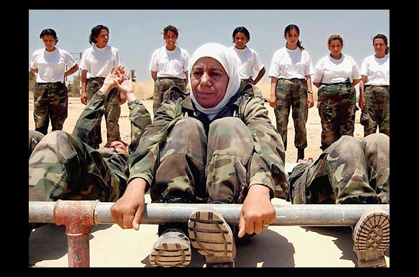 iraqi women soldiers perform sit-ups at a training camp in zarqa, jordan