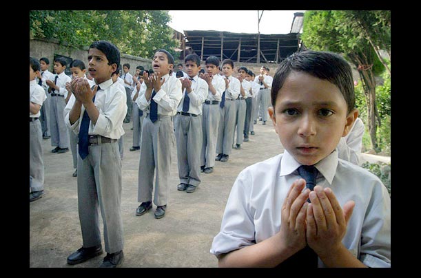 children pray in bait-ul-hilal, a school for orphans in kashmir