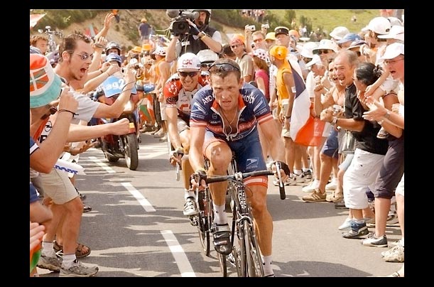 Supporters cheer for cyclist Lance Armstrong during the Tour de France