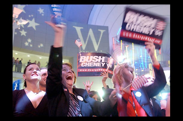 Bush supporters Carla Daly, Mary Wilson and Lisa Bierman cheer as results come in on election night