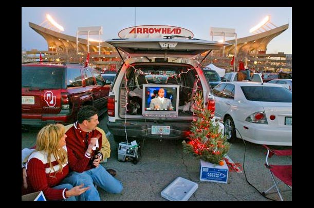 Oklahoma football fans watch the Southern California-UCLA game at Arrowhead Stadium in Kansas City, Missouri, before the Big 12 Championship game