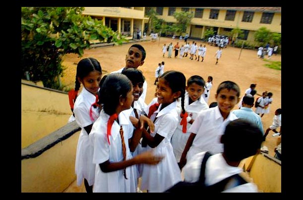 Students laugh and talk on the first day of class after schools in Panadura, Sri Lanka