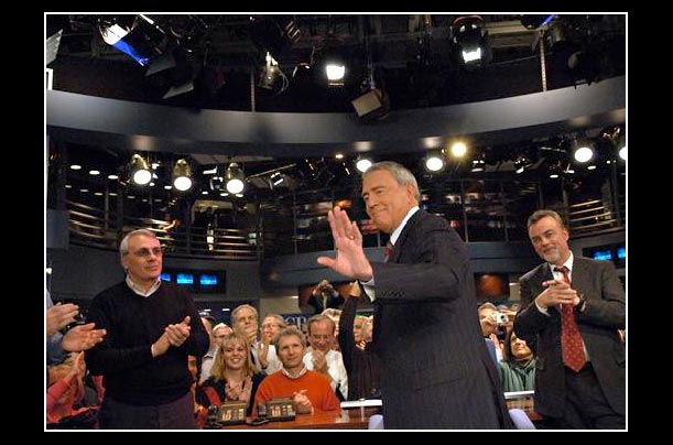 Dan Rather acknowledges applause after his last broadcast as anchor of the CBS evening news in New York
