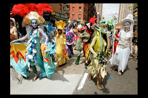 People in costume participate in the Rites of Spring Procession to Save Our Gardens in the Lower East Side of New York City in an effort to bring environmental awareness and protection of community gardens