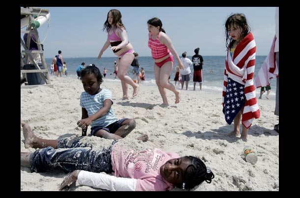 children play on the beach during the new york airshow at jones beach in wantagh, new york