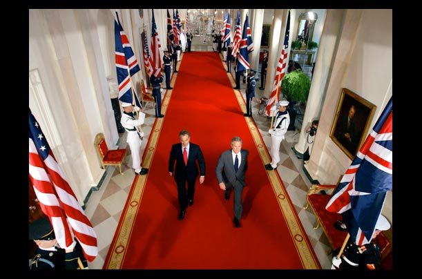 President George W. Bush and British Prime Minister Tony Blair arrive for a White House press conference