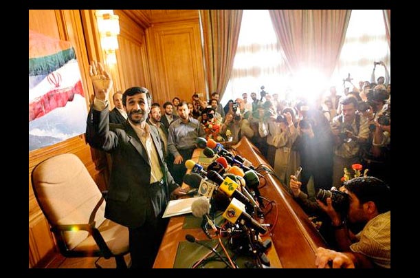 Iranian president elect Mahmoud Ahmadinejad waves to journalists at a press conference