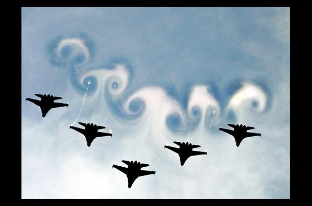 Russian military air force creates sky patterns with MIG 29 jet-fighters during an air show in Monino, near Moscow, Russia, commemorating the 60th anniversary of World War II victory