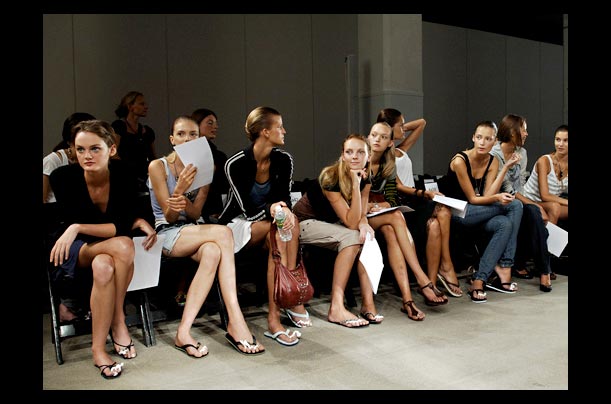 Models wait to walk down the runway before the start of Narcisco Rodriguez spring/summer 2006 collection during New York Fashion Week