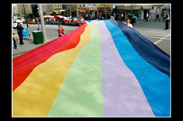 Marchers carry Australia's largest flag during a the 23rd anniversary of the International Day of Peace in Melbourne