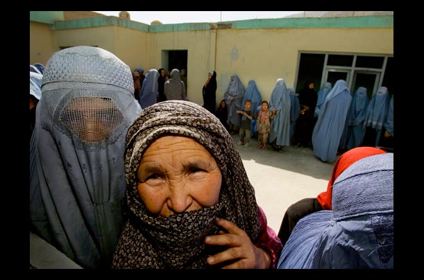 In Kabul, Afghan women wait in line to vote in the nation's first parliamentary election