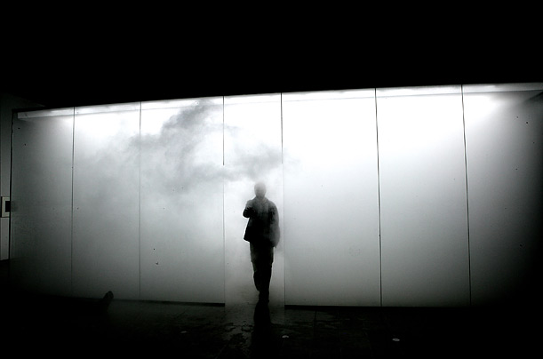 Antony Gormley exits his installation 'Blind Light' staged by Hayward Gallery in London.