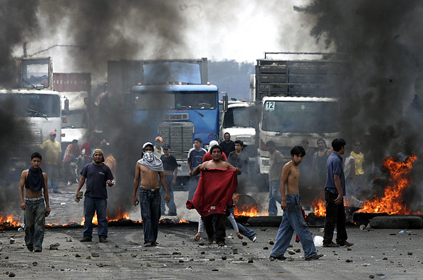 Guatemalan citizens block highways in protest of the re-election of Mayor Jose Lopez of the Unidad Nacional de la Esperanza party, in the municipality of Palin, the day after general elections.