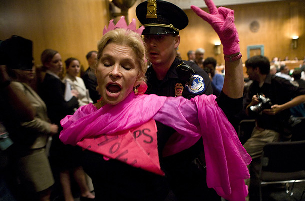 A protester is removed from a hearing of the Senate Appropriations Committee on supplemental defense spending for the wars in Iraq and Afghanistan, in Washington, D.C.