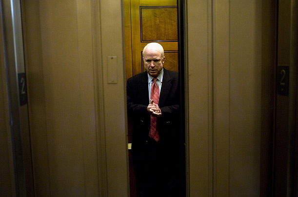 Presidential hopeful Senator John McCain boards an elevator on Capitol Hill after voting against setting a withdrawal date from the Iraq War.