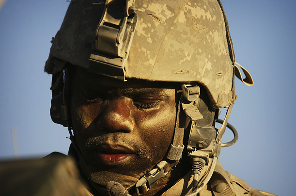 Staff Sergeant Anttwain Dobbins, of St. Louis, Missouri, is covered in dust after patrolling near Panjwaii, Afghanistan.