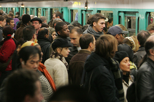 French commuters cram onto the subway in Paris on the first day of a transit strike in France.