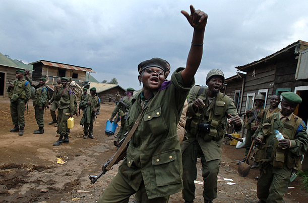 Government soldiers celebrate taking control of Mushake, in the Democratic Republic of Congo, after a second day of heavy clashes with rebel soldiers.
