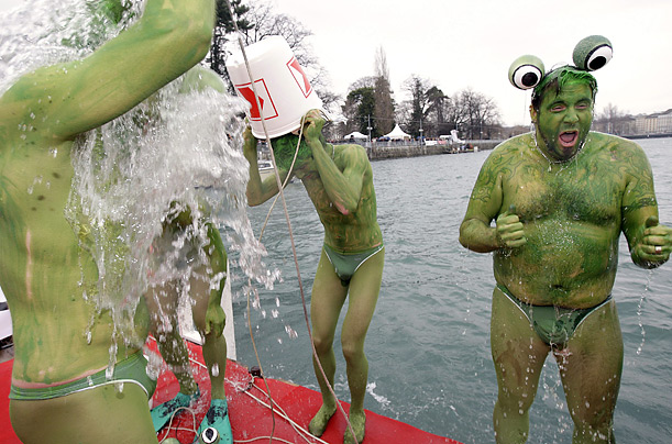 Swimmers prepare to jump into Lake Geneva. More than 700 reckless men and women swam in the 40-degree water during the annual Christmas swim.