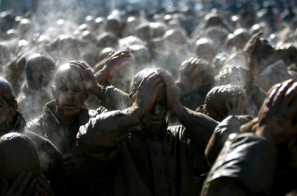 Iranian Shiites cover themselves in mud during a ritual on the final day of Ashura in the Kurdish city of Bijar, Iran.