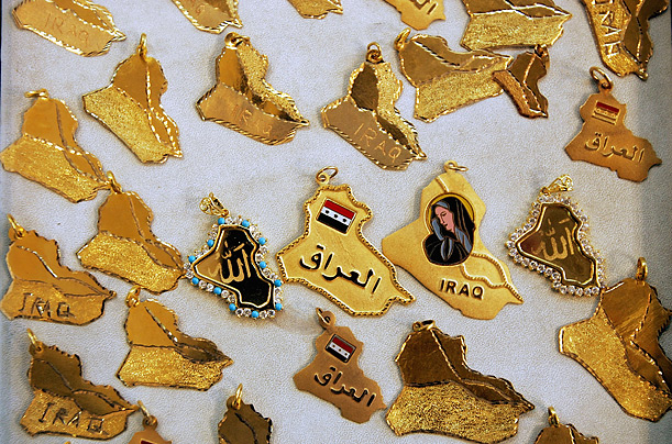 Gold pendants are displayed in a jewelry shop in the Iraqi capital. Gold, often used in dowries, is regarded as a safe way to protect savings from inflation.
