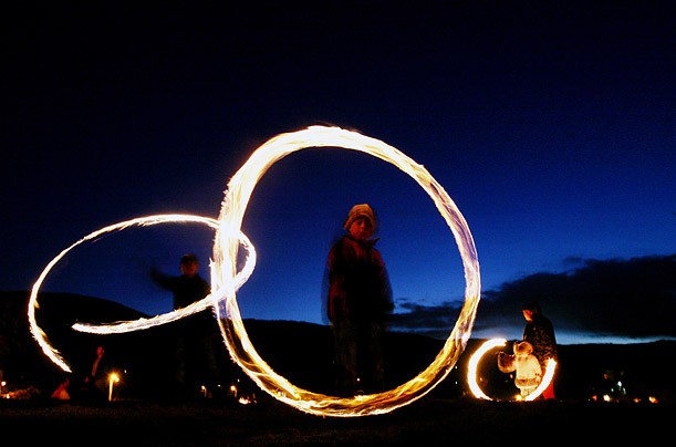 Bulgarian children swirl fireballs in the village of Lozen, in celebration of Mesni Zagovezni, an Orthodox Christian holiday during which evil spirits are chased away.  
