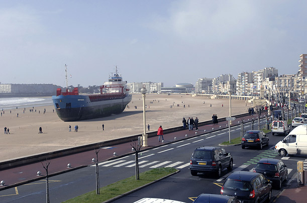 People stroll around the Dutch cargo ship 