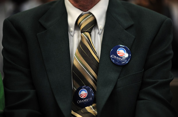 A Barack Obama supporter watches the candidate speak at a campaign event in Erie, Pennsylvania.