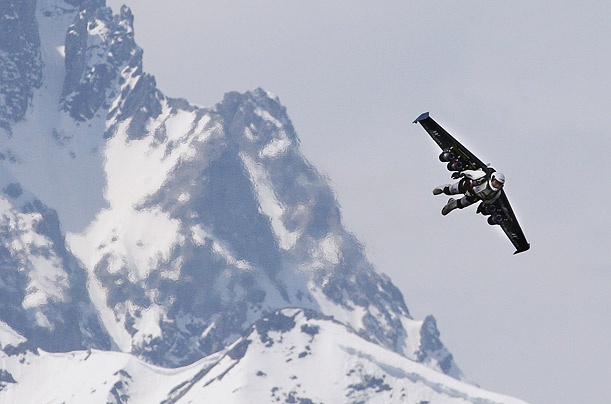 Yves Rossy, also known as 'Fusion Man,' flies with a jet-powered single wing over the Alps in Bex, Switzerland.