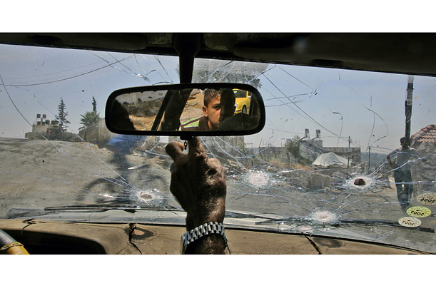 A car's windshield was damaged by rubber bullets during an Israeli imposed curfew on the West Bank village of Nilin.