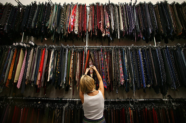 A worker sorts through neckwear at Angels The Costumiers in London, where 120 staff members look after 4 million costumes hanging on 6 miles of rails. 

