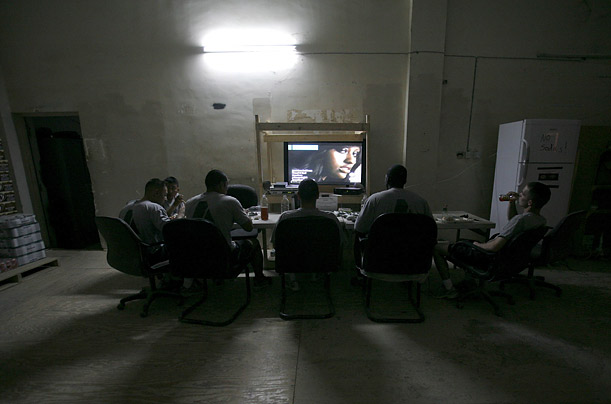 U.S. soldiers from the Second Stryker Cavalry Regiment watch television at Diyala media center in Diyala province
