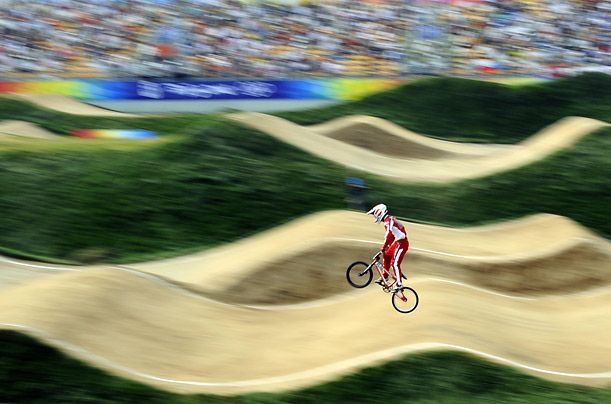 Kyle Bennett of Japan competes in the men's seeding phase of the Olympic BMX cycling event at the Laoshan Bicycle Motor Cross Venue in Beijing