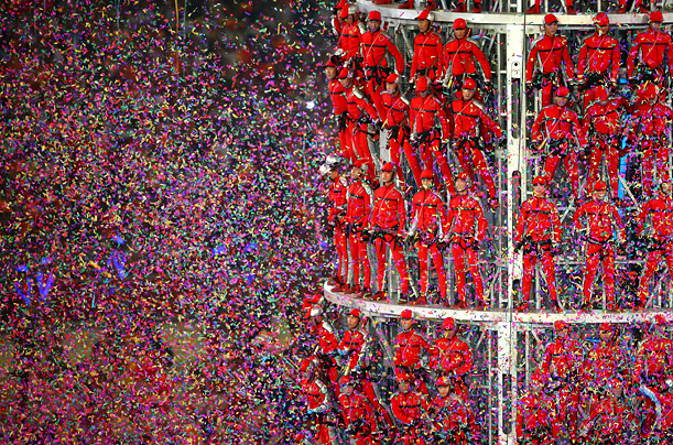 Confetti pours down on performers at the 2008 Olympics Games closing ceremony in Beijing