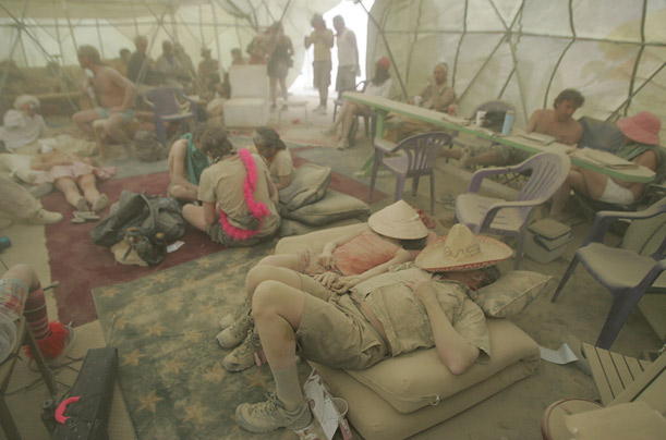 Participants of Burning Man festival wait out a dust storm in the Jazz Cafe in the Black Rock Desert on the fifth day of the annual event.