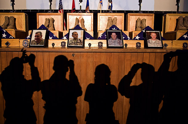 Photographers take pictures at a memorial service for seven Texas and Oklahoma National Guard soldiers killed in a CH-47 Chinook crash in Iraq. 

