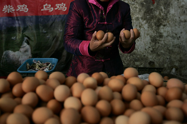 A merchant sells eggs in Beijing, China. Excess levels of melamine have been found in Chinese eggs, leading Hong Kong authorities to expand health tests on meat products coming from China.


