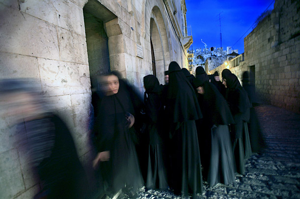 A group of nuns walk on the Via Dolorosa in Jerusalem's Old City.

