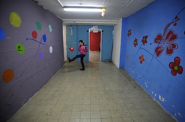 An Israeli girl plays inside a bomb shelter in the southern city of Ashkelon, a town which has endured mortar strikes fired from within the Gaza Strip.