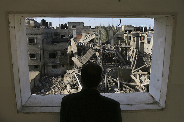 A man overlooks destruction caused by an Israeli airstrike in the Rafah refugee camp in Gaza.

