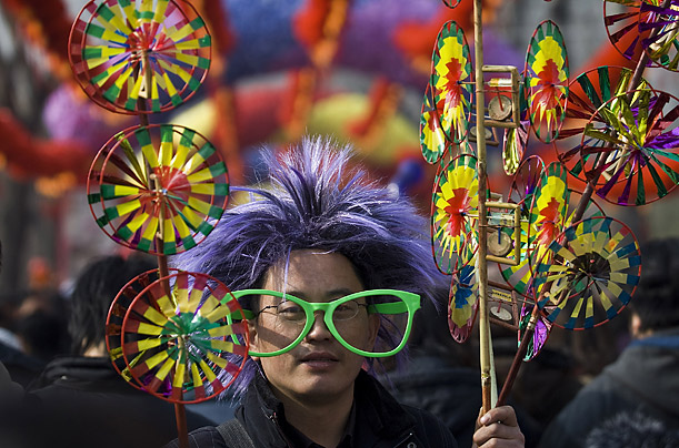 A vendor sells hand-made fans at the Longtan Temple fair during the Chinese New Year celebration in Beijing, China.


