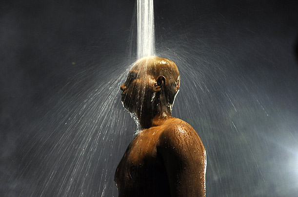 A Hindu devotee takes a ceremonial shower before making a pilgrimage to the Batu Caves temple during the festival of Thaipusam in Kuala Lumpur.
