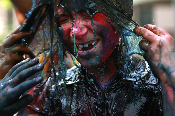 During Holi, a Hindu festival celebrating Spring, residents of Kolkata and other Indian cities toss and smear colored powder on one another. 
