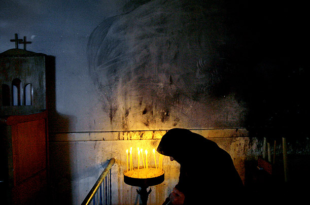 A Greek orthodox nun prays at the Apostolos Andreas monastery in Turkish occupied northern Cyprus.

